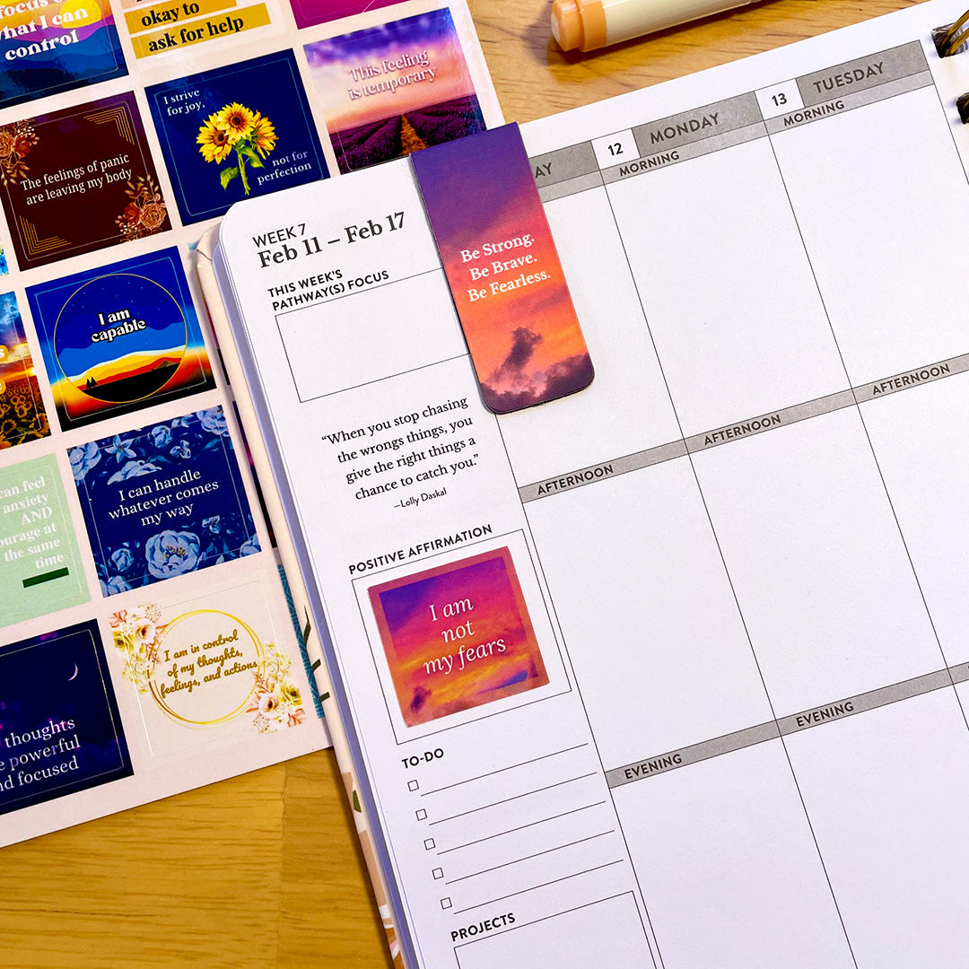 Planner decorated with Positive Affirmation Stickers – Motivational & Uplifting, showing a quote sticker enhancing weekly focus and mindset organization.