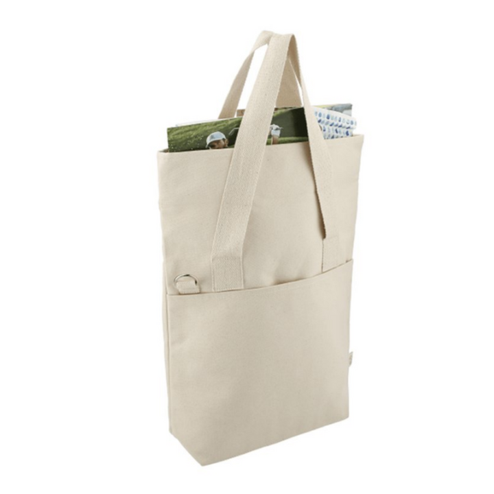 Side view of 'One More Chapter' Organic Cotton Tote Bag showing spacious interior with books and magazines inside front pocket.