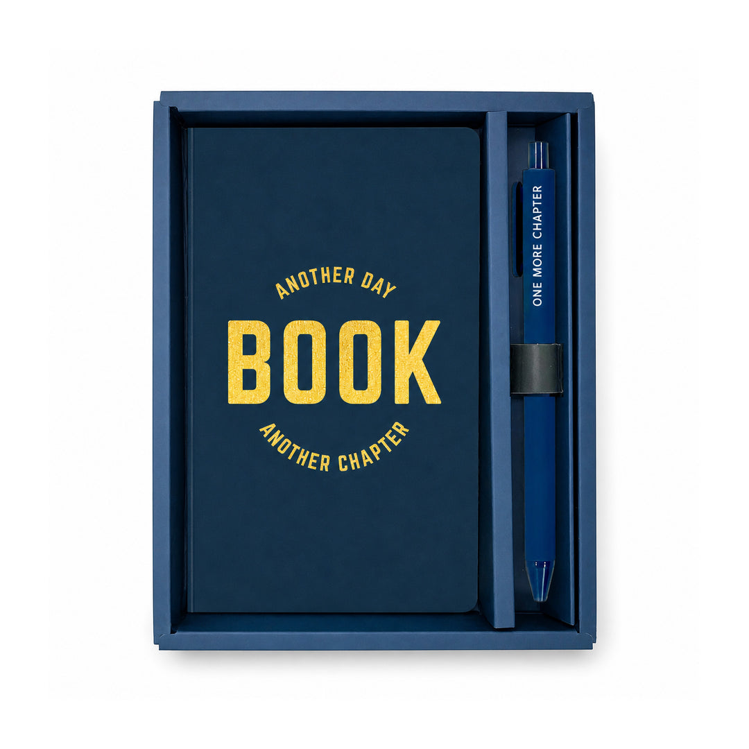 Blue notebook with yellow text and a matching pen in a box on a white background #color_book-edition