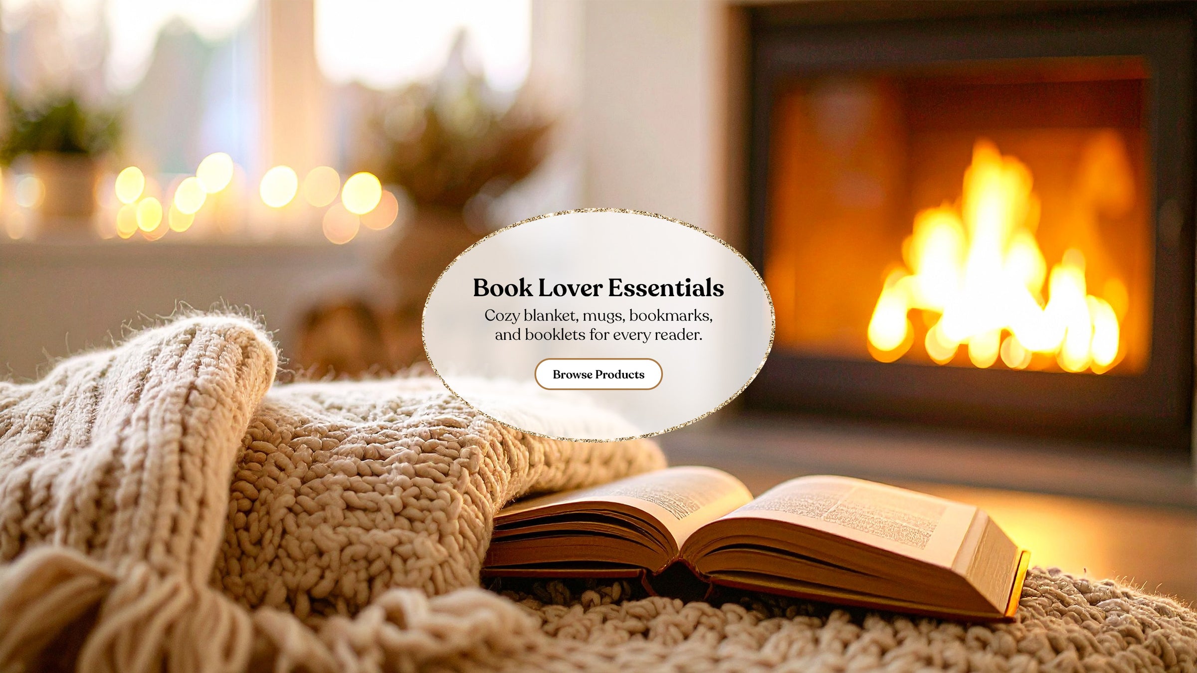 Open book on a cozy blanket in front of a fireplace with 'Book Lover Essentials' text overlay.