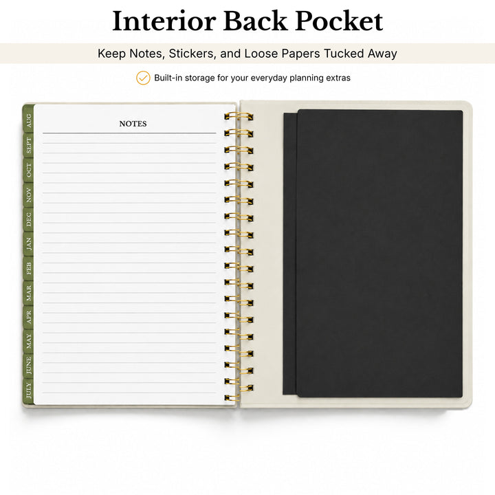 Open planner showing interior back pocket with lined pages and a black pocket.  