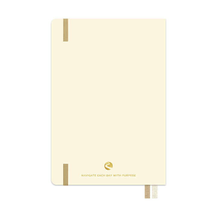Beige planner with gold accents on a white background 