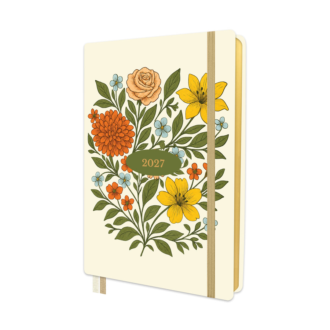A cream-colored 2027 pocket calendar or planner with a retro floral illustration on the cover, featuring yellow, orange, and blue flowers with green leaves, held closed by a beige elastic band. 