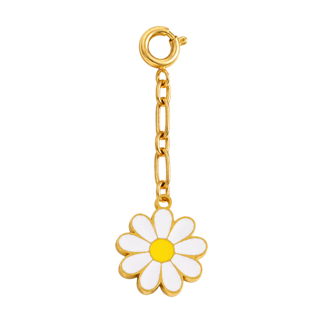 Gold charm with a white daisy flower on a white background 