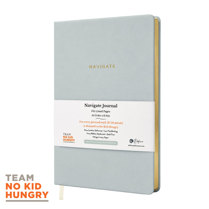 A blue faux leather softcover journal with matte gold trim and a ribbon bookmark labeled &