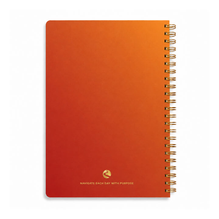 Orange notebook with gold spiral binding on a white background 