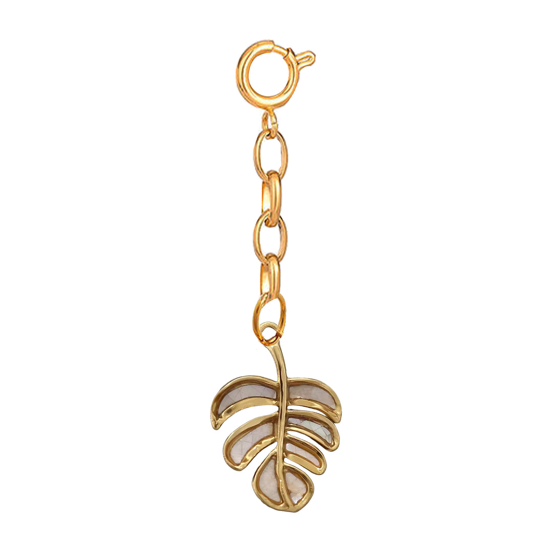 Gold leaf-shaped charm on a white background 
