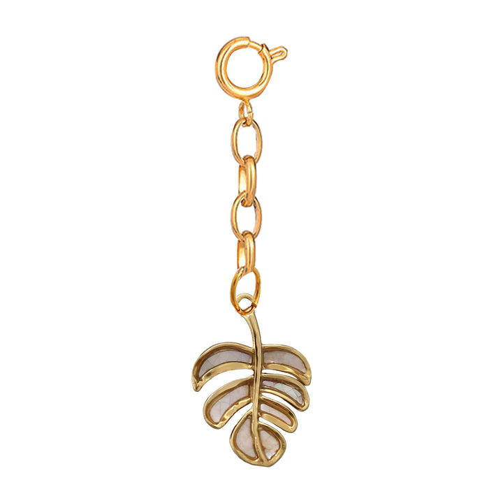Gold leaf-shaped charm on a white background 