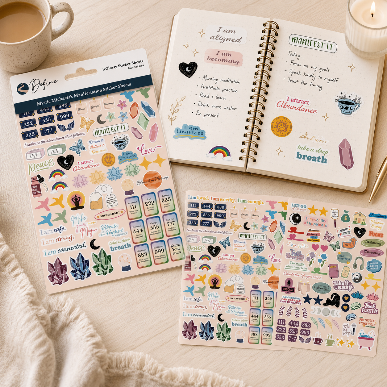 Open notebook with stickers and a cup of coffee on a light surface
