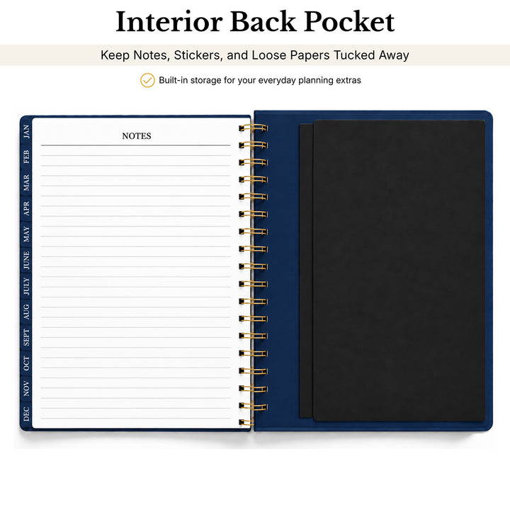 An open spiral-bound planner or notebook shown from the inside back pocket view, with a navy blue cover, black pocket insert, and lined notes page. Text at the top reads &