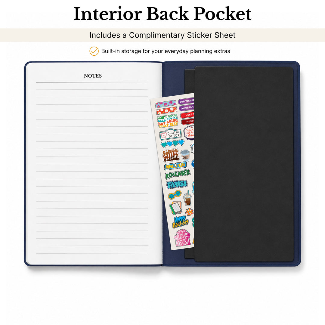 Open Planner with lined pages, a black cover, and a sheet of colorful stickers on a white background. 