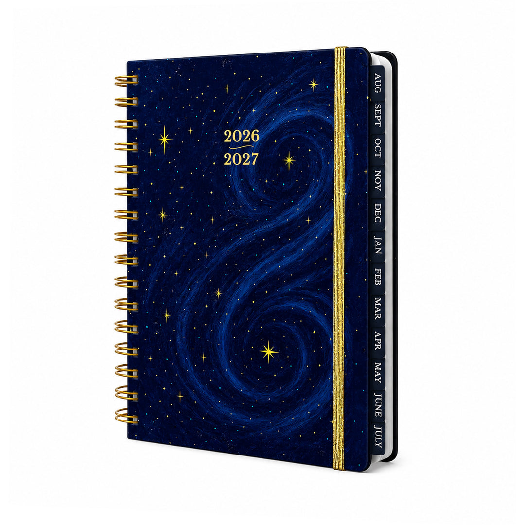 Planner with starry night design and gold spiral binding on a white background 