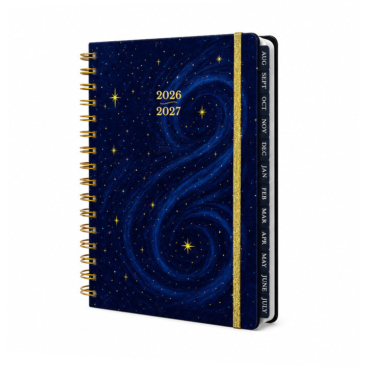 Planner with starry night design and gold spiral binding on a white background 