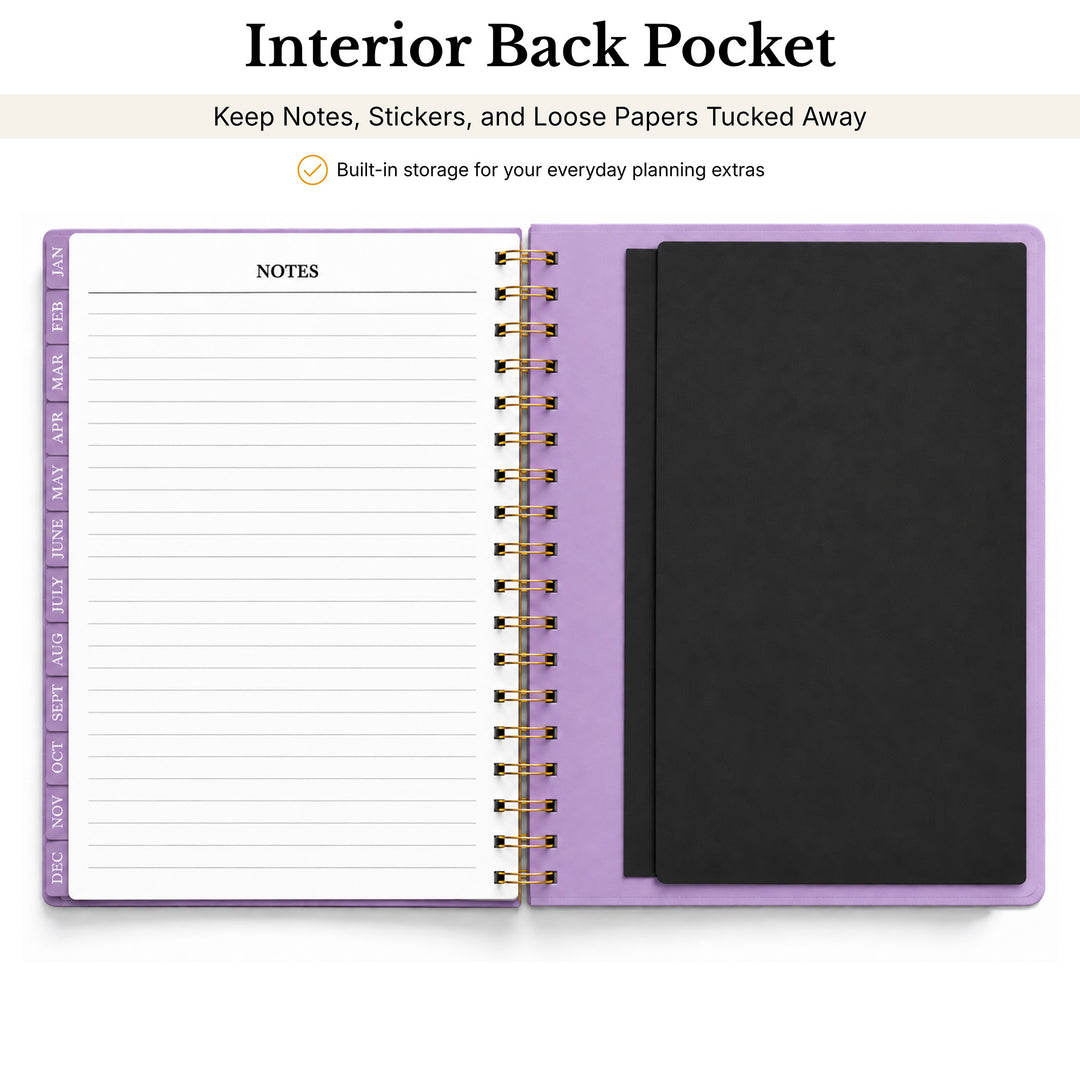A spiral-bound planner or notebook shown open on a white background, with a lavender/light purple cover and a black interior pocket. Text above reads &