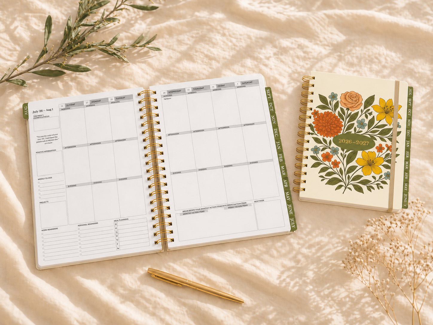 Open planner with floral notebook and pen on a soft surface