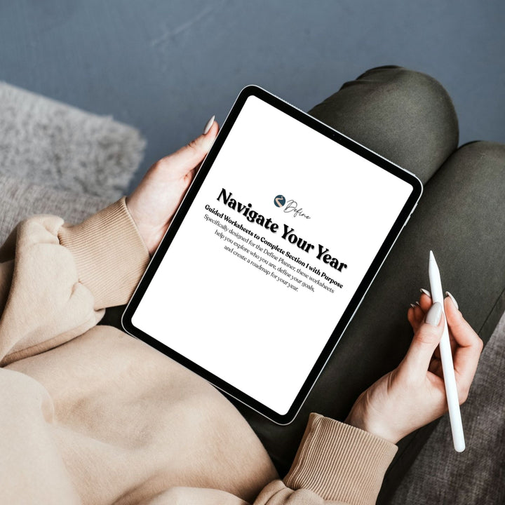 Person holding a tablet with a screen displaying &