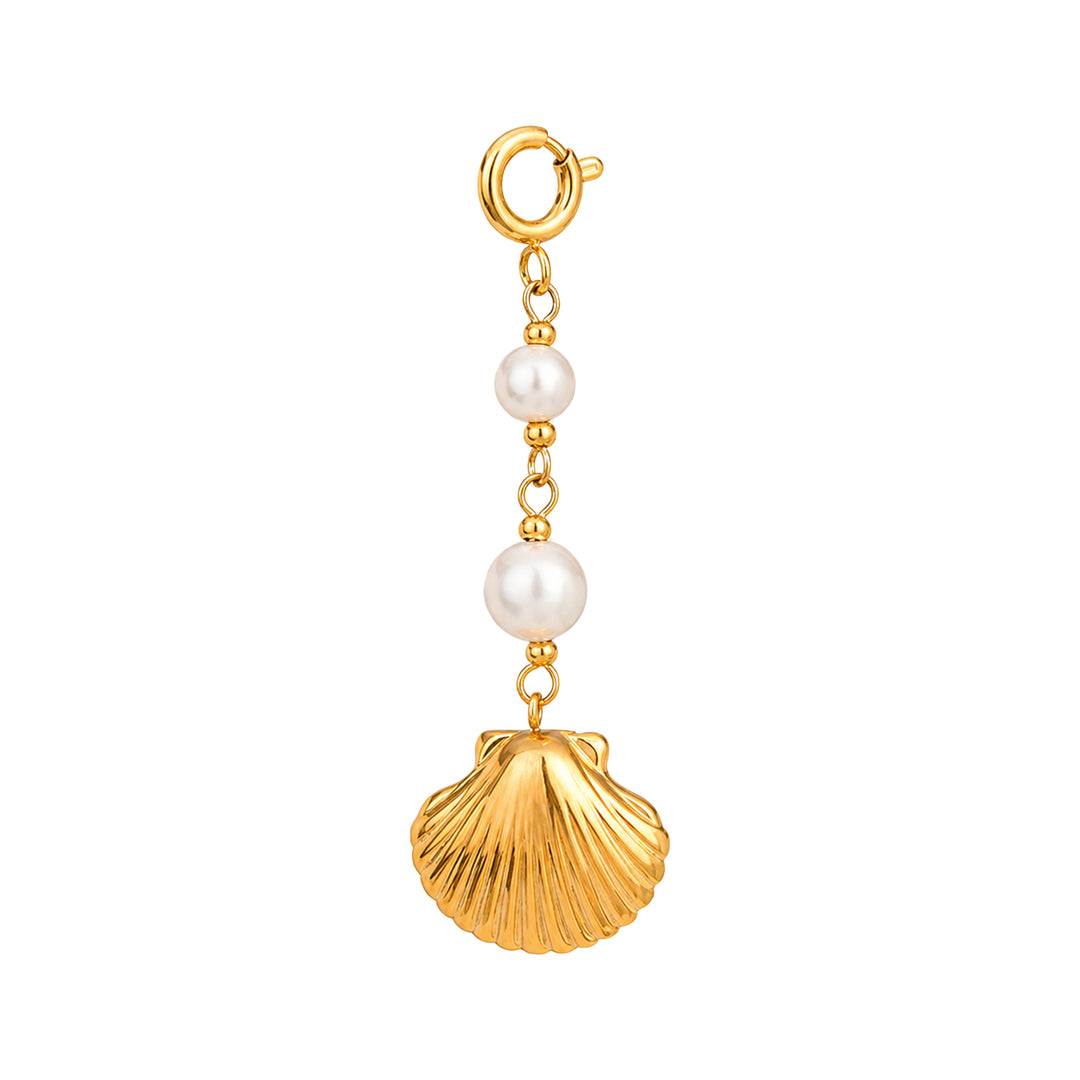 Gold charm with pearls and a shell on a white background 