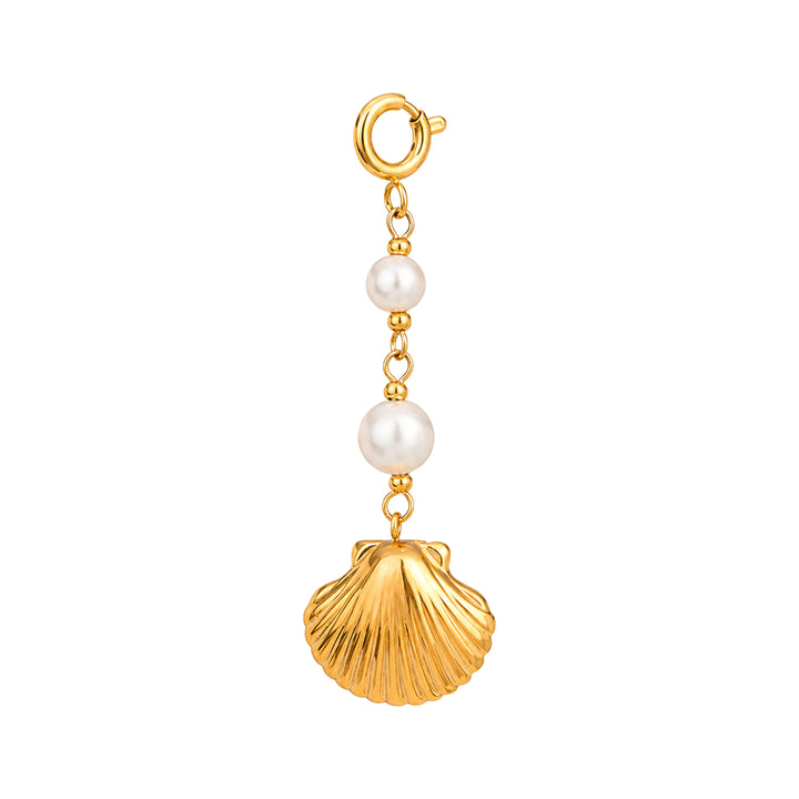 Gold charm with pearls and a shell on a white background 