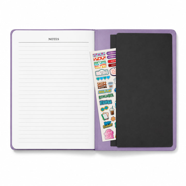 Purple notebook with a sticker sheet and black cover on a white background 