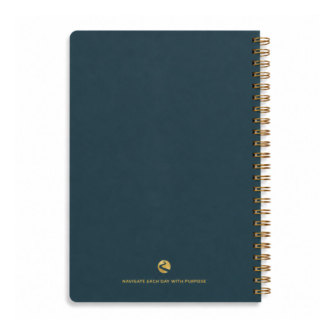 Blue notebook with gold spiral binding on a white background 