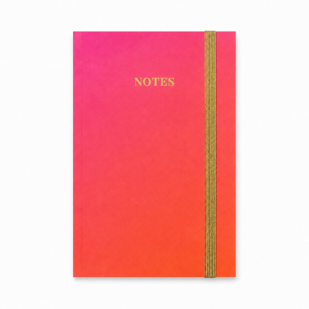 Gradient notebook with pink to orange colors and &