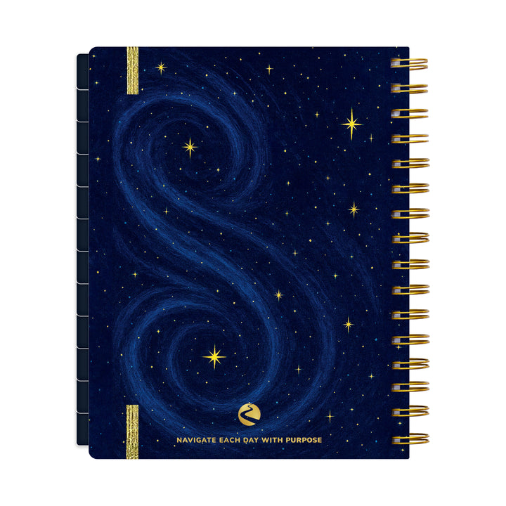 Planner with starry night design and gold accents on a white background 