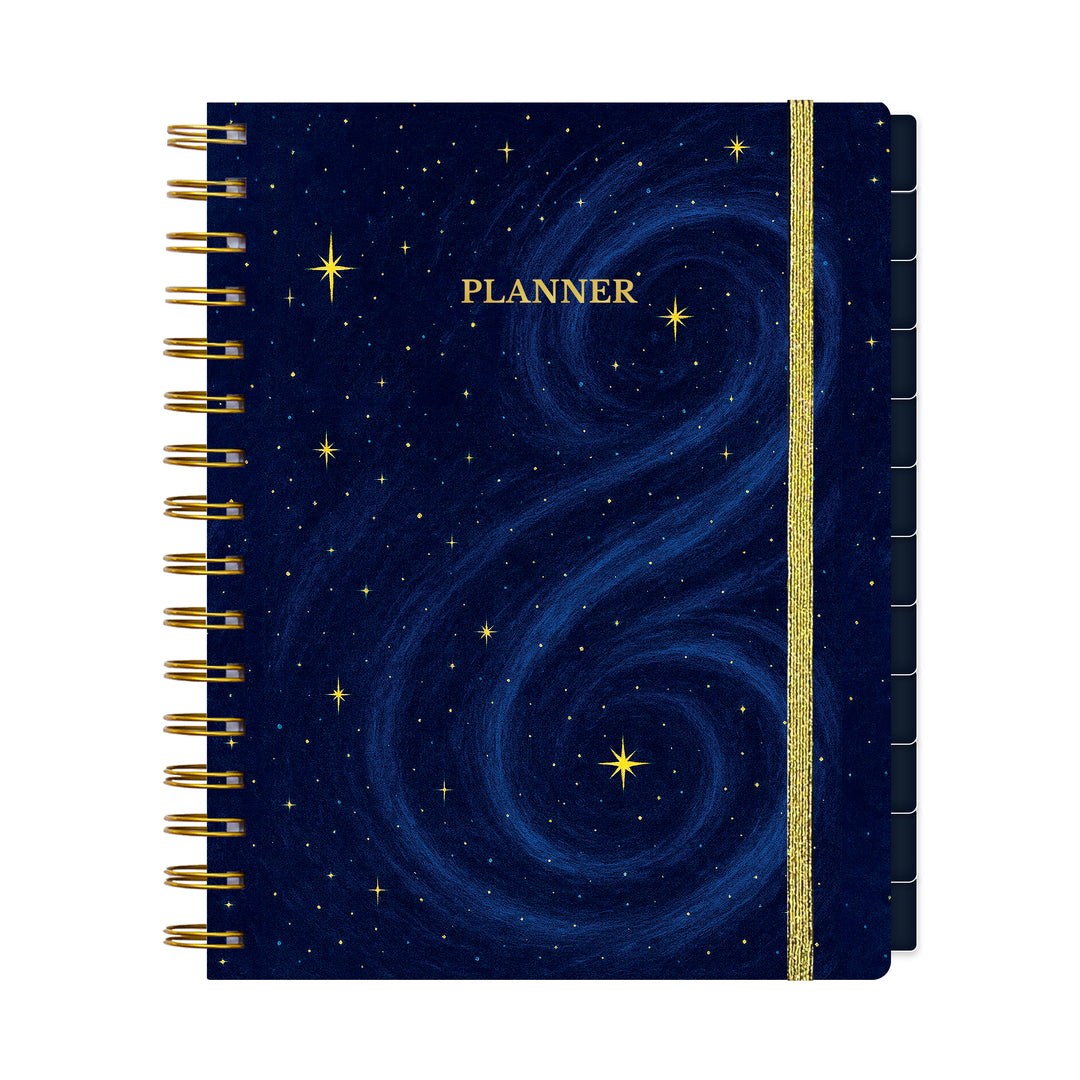 Planner with starry night design and gold spiral binding on a white background 