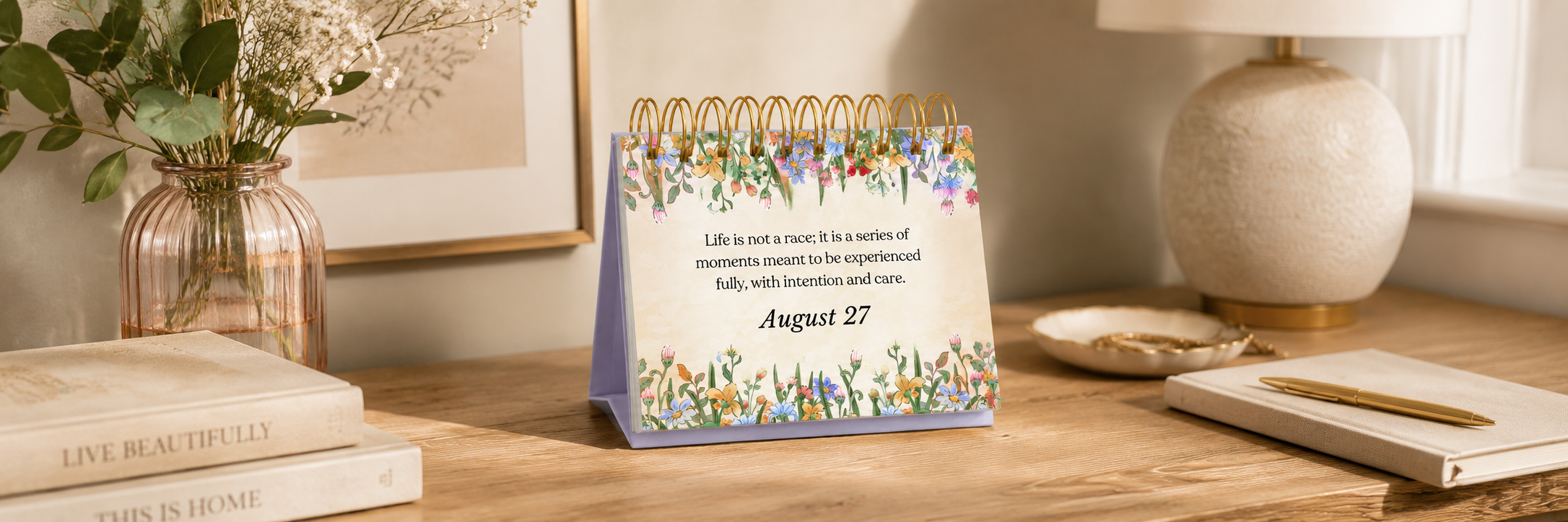 Desk calendar on a wooden surface with decorative elements