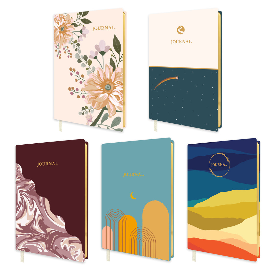 Set of five softcover journals with various designs on a white background.