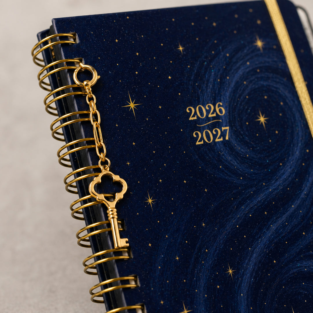 Blue planner with gold key charm and &