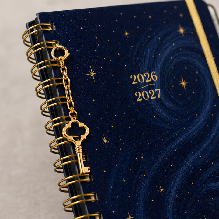 Blue planner with gold key charm and &