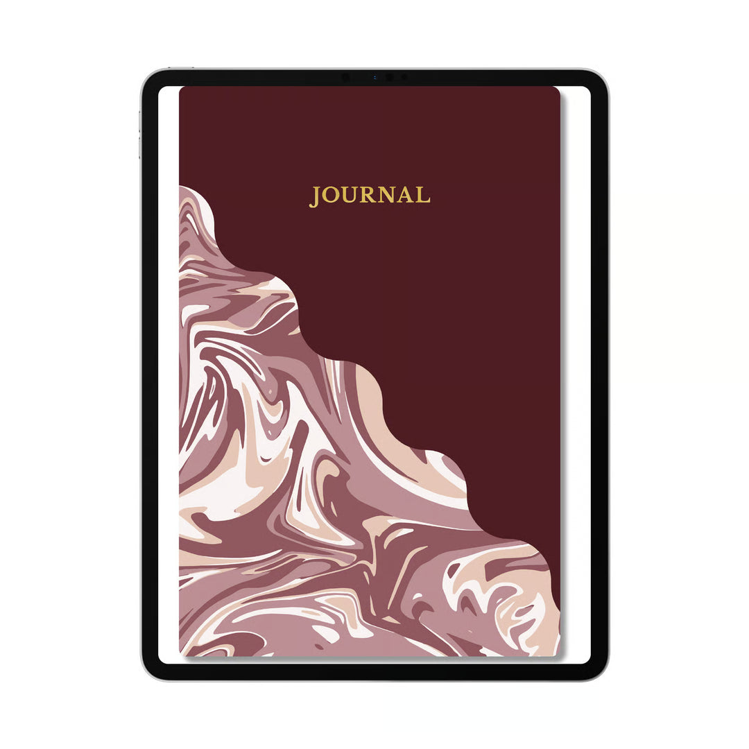 A hardcover journal with a dark burgundy cover, featuring a marbled pattern in dusty pink, mauve, and cream on the lower half, with the word &