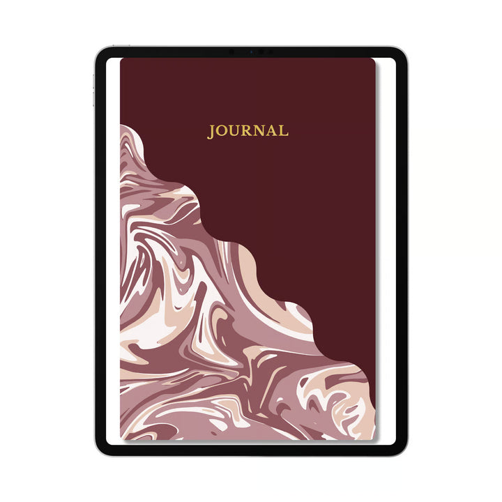 A hardcover journal with a dark burgundy cover, featuring a marbled pattern in dusty pink, mauve, and cream on the lower half, with the word &