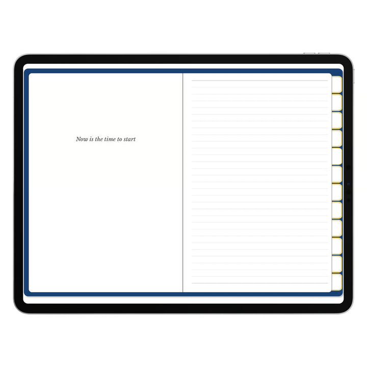 An open tabbed planner or notebook with a black cover, featuring a blank left page with the text &