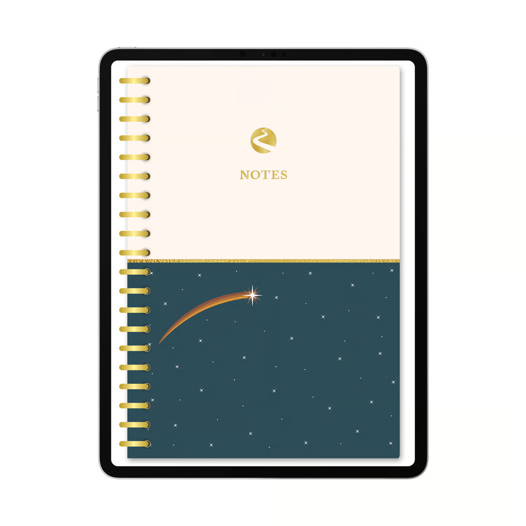 A spiral-bound notebook with a cream top half and a dark teal bottom half featuring a shooting star and stars. The cream section has a gold logo and the word NOTES, and the left edge shows gold spiral binding. 