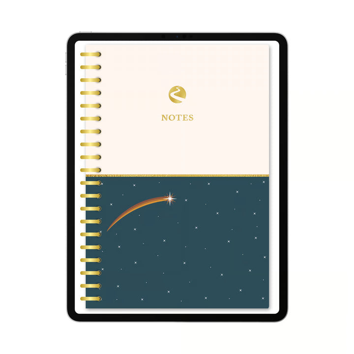 A spiral-bound notebook with a cream top half and a dark teal bottom half featuring a shooting star and stars. The cream section has a gold logo and the word NOTES, and the left edge shows gold spiral binding. 
