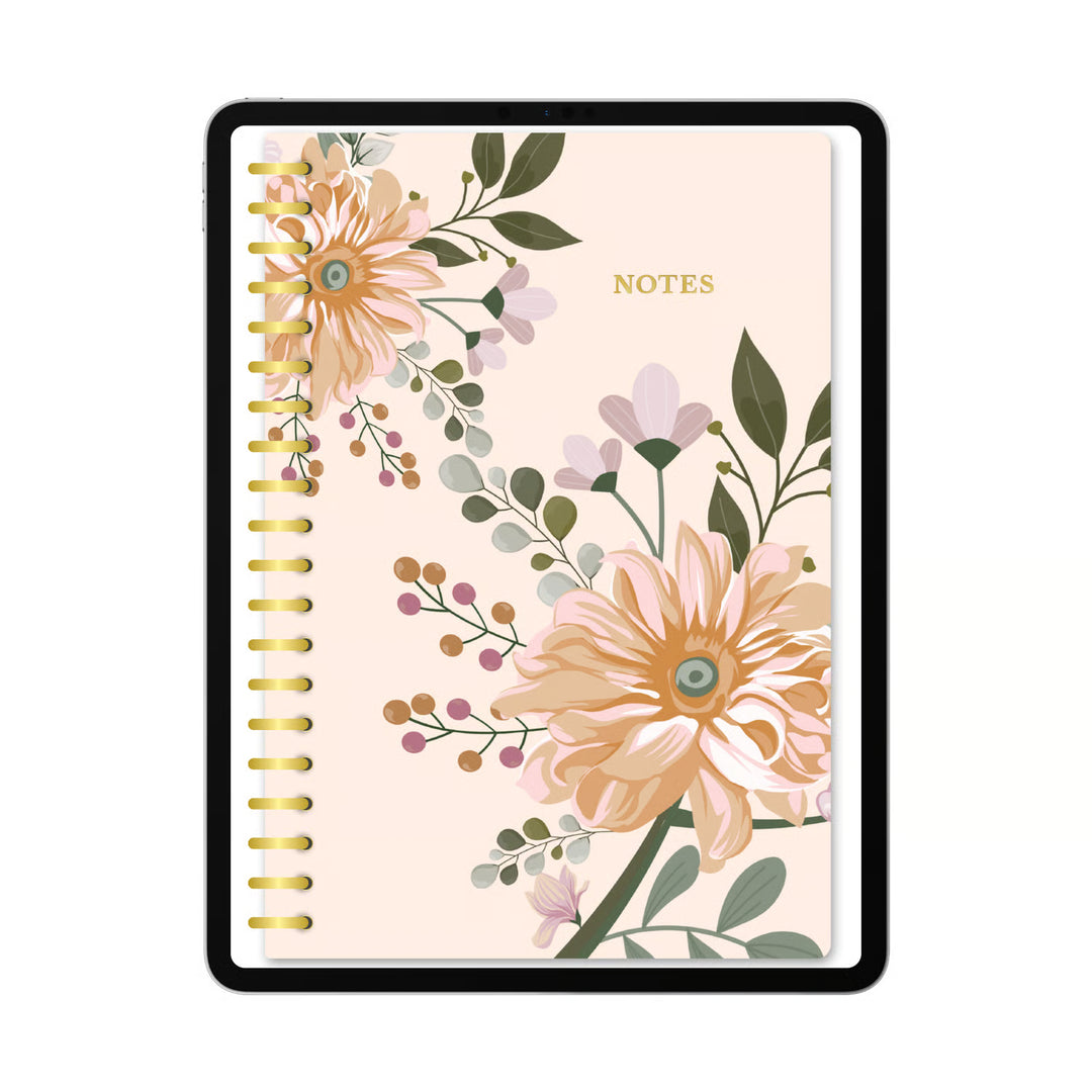 A spiral-bound notebook with a black cover border, featuring a floral design with peach and pink flowers, green leaves, and gold spiral binding on a white background. 