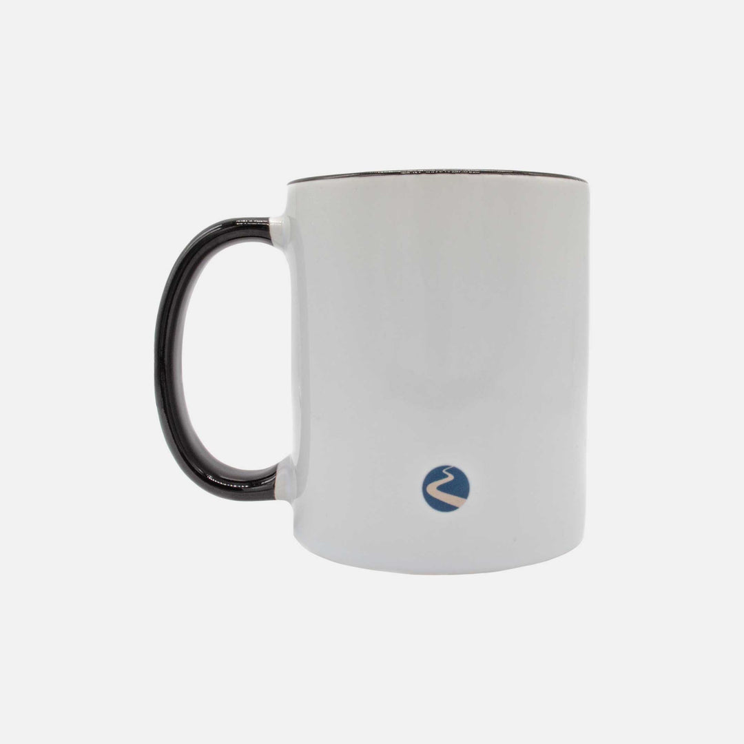 Back of a white mug with a black handle. On the bottom of the mug is the define logo.