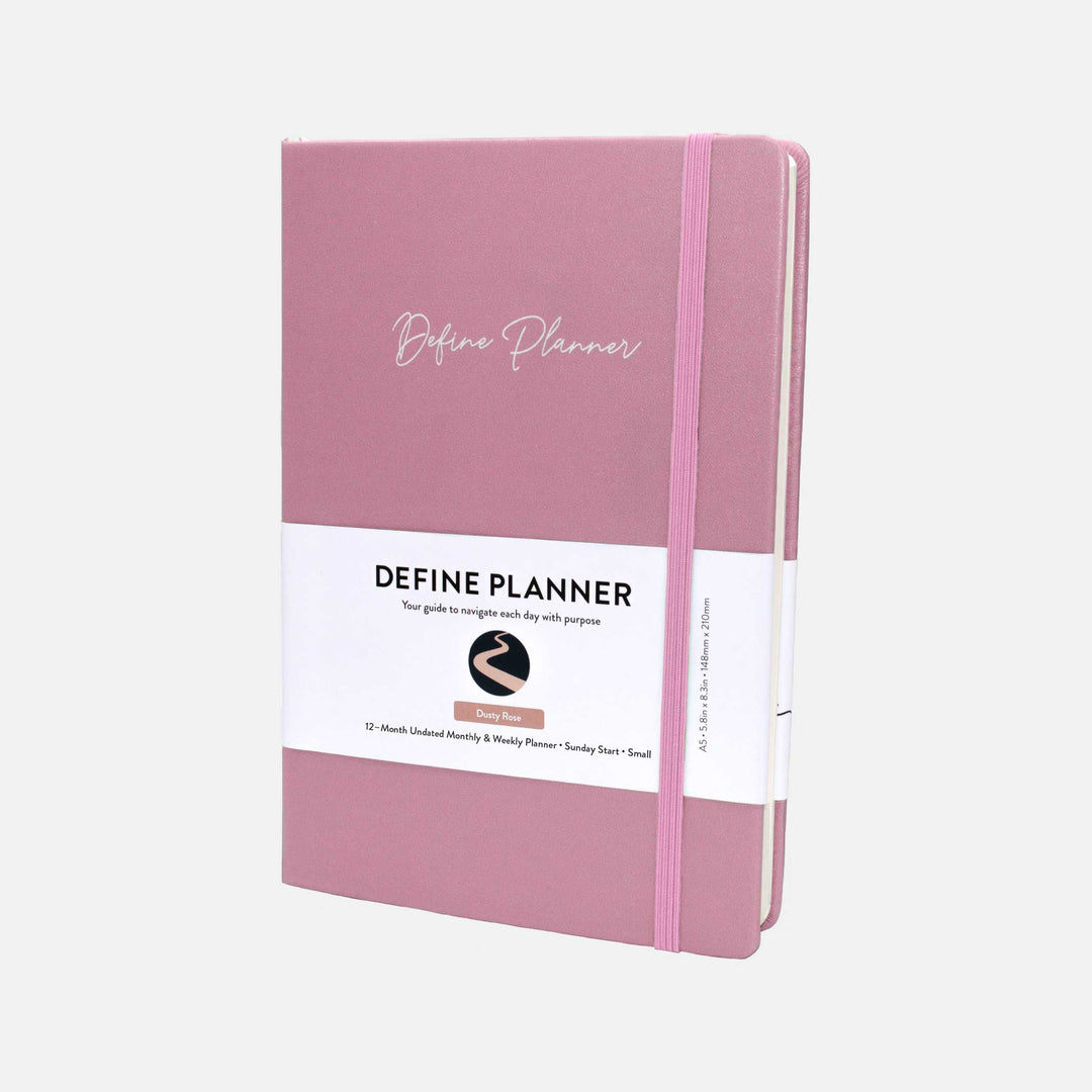 Cover of the pink 12 month undated monthly and weekly planner. It is an A5 size and has a pink elastic band to help keep it closed. #color_dusty-rose